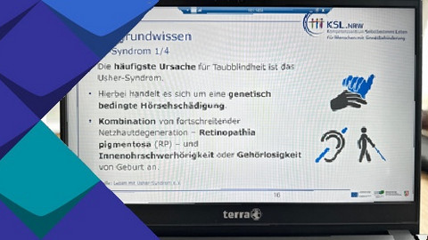 Eine Präsentationsfolie am Laptop zum Thema Usher-Syndrom